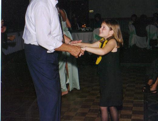 Grandpa Bob dancing with 9-year-old Caitlin